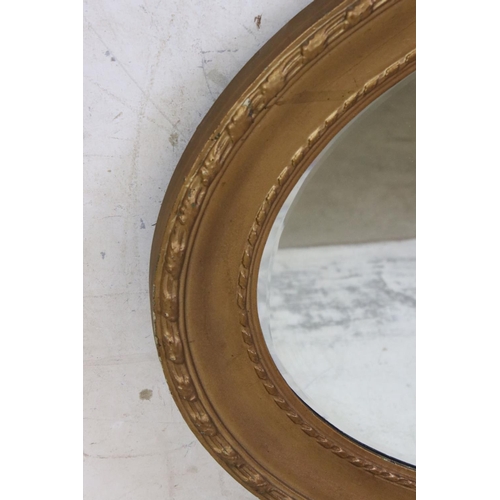 581 - Gilt Framed Oval Wall Mirror with bevelled edge, 89cm long