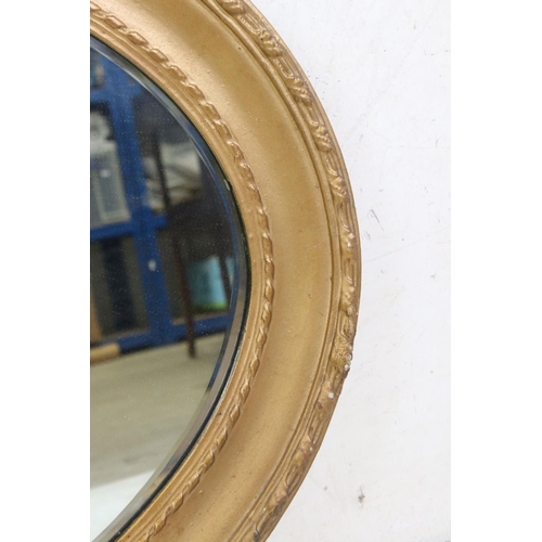 581 - Gilt Framed Oval Wall Mirror with bevelled edge, 89cm long