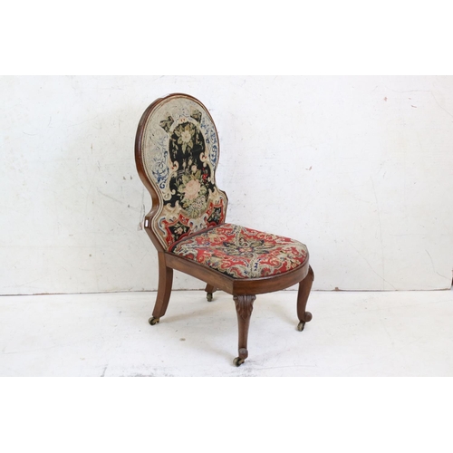 585 - Victorian Spoon Back Nursing Chair with needlework upholstered back and seat, raised on carved scrol... 