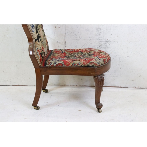 585 - Victorian Spoon Back Nursing Chair with needlework upholstered back and seat, raised on carved scrol... 