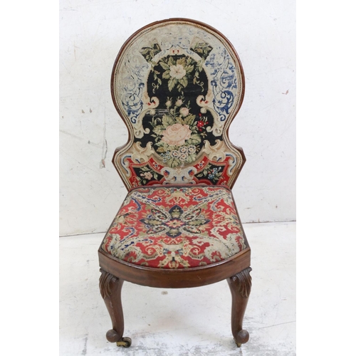 585 - Victorian Spoon Back Nursing Chair with needlework upholstered back and seat, raised on carved scrol... 