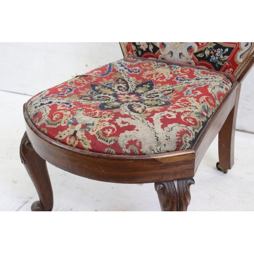 585 - Victorian Spoon Back Nursing Chair with needlework upholstered back and seat, raised on carved scrol... 