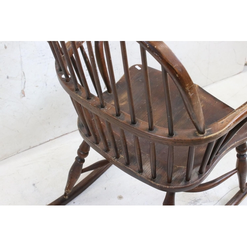 588 - 19th century Ash and Elm Windsor Hoop Back Rocking Elbow Chair with crinoline stretcher, 65cm wide x... 