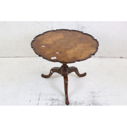 589 - George III style Walnut Tilt Top Low Table, the top with shaped moulded edge over a turned column su... 