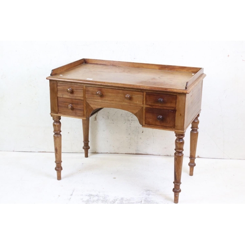 590 - 19th century Mahogany Kneehole Dressing Table with three quarter back rail, an arrangement of four d... 