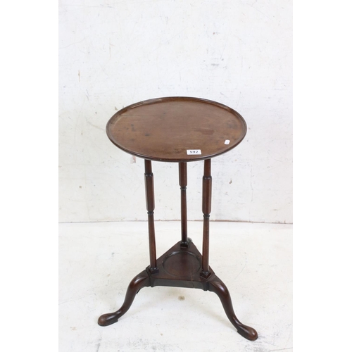 592 - Early 19th century Mahogany Circular Lamp / Wine Table, the tray top  raised on three slender suppor... 