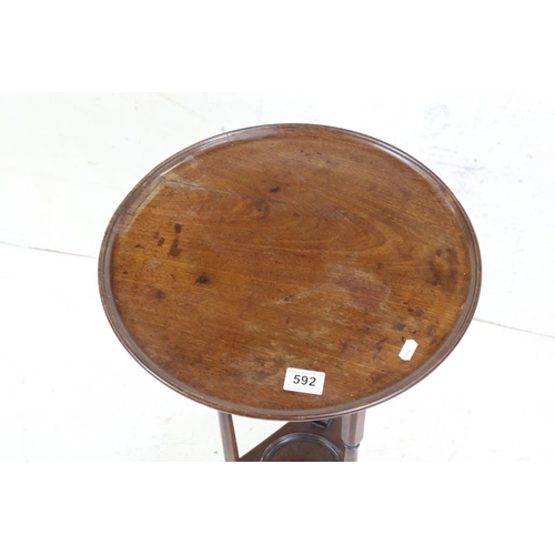 592 - Early 19th century Mahogany Circular Lamp / Wine Table, the tray top  raised on three slender suppor... 