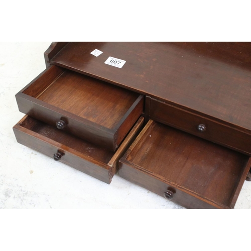 607 - Mahogany Table Top Book Trough with four drawers beneath, 47cm wide x 23cm high