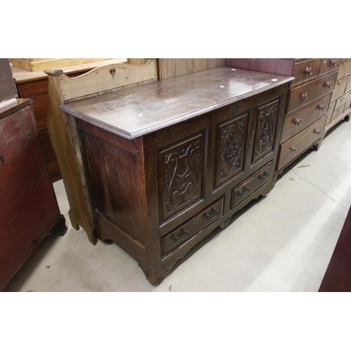 608 - 18th century Oak Coffer / Dowry Chest, with hinged lid, three carved panels to front and two drawers... 