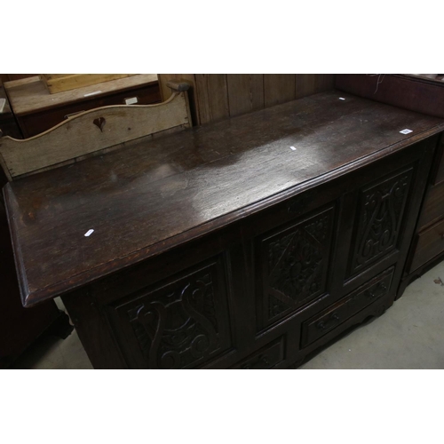 608 - 18th century Oak Coffer / Dowry Chest, with hinged lid, three carved panels to front and two drawers... 