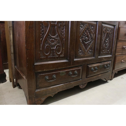 608 - 18th century Oak Coffer / Dowry Chest, with hinged lid, three carved panels to front and two drawers... 