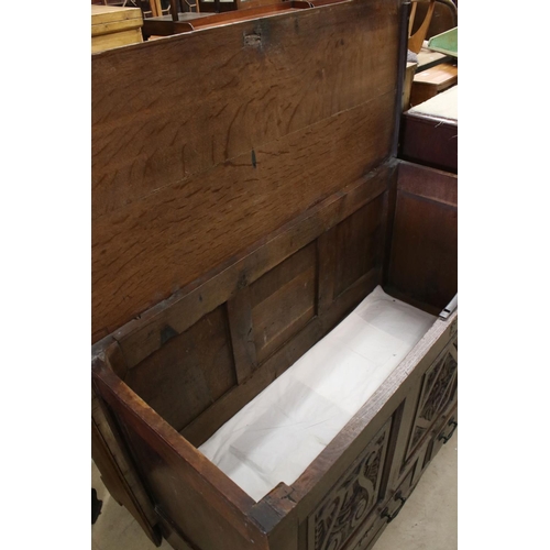 608 - 18th century Oak Coffer / Dowry Chest, with hinged lid, three carved panels to front and two drawers... 