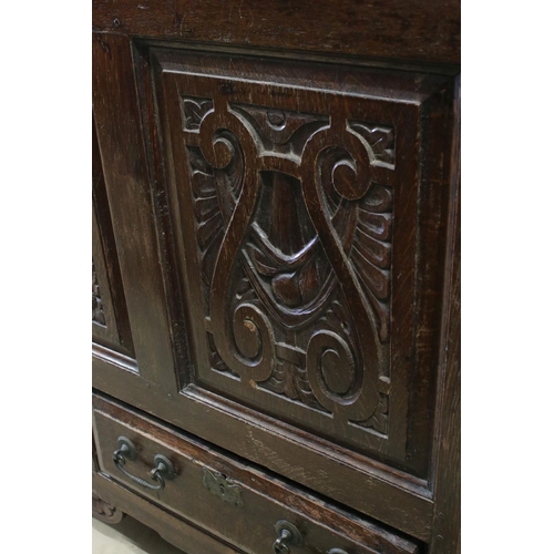 608 - 18th century Oak Coffer / Dowry Chest, with hinged lid, three carved panels to front and two drawers... 