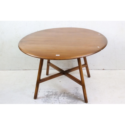 615 - Ercol Golden Elm Circular Drop Dining Table, 114cm diameter x 72cm high