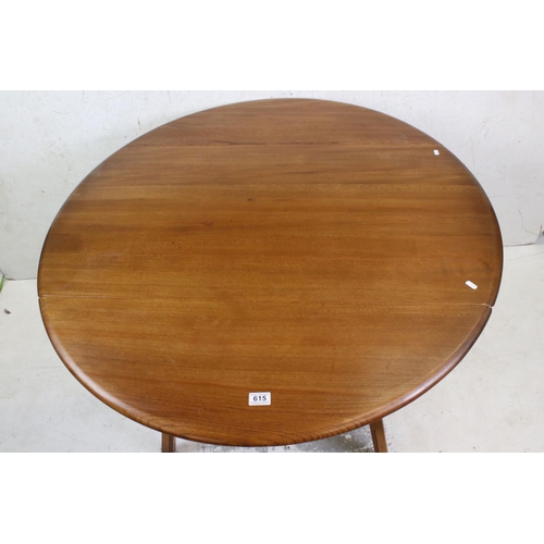 615 - Ercol Golden Elm Circular Drop Dining Table, 114cm diameter x 72cm high