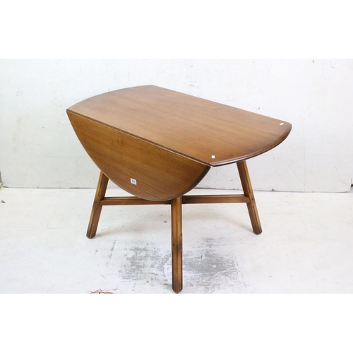 615 - Ercol Golden Elm Circular Drop Dining Table, 114cm diameter x 72cm high