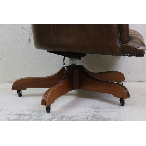 634 - Victorian style Brown Buttoned Leather Upholstered Swivel Armchair, 68cm wide x 118cm high