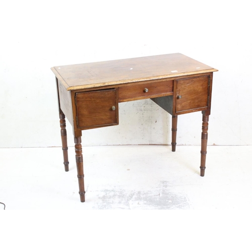 638 - 19th century Mahogany Kneehole Desk / Dressing Table, with three drawers, raised on turned ringed le... 