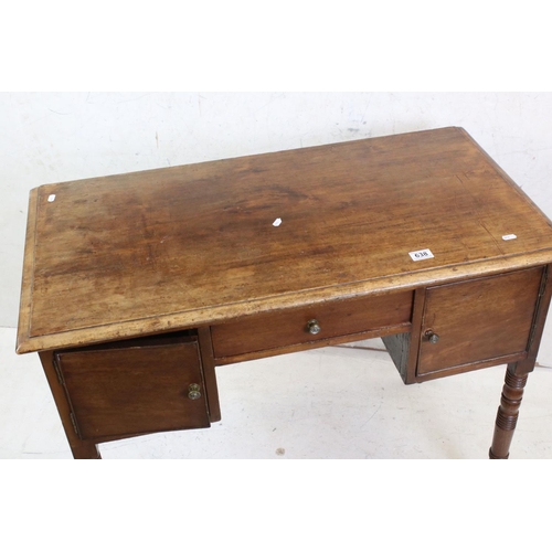 638 - 19th century Mahogany Kneehole Desk / Dressing Table, with three drawers, raised on turned ringed le... 