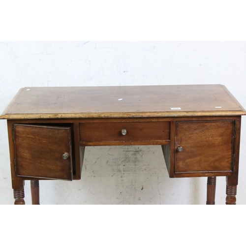 638 - 19th century Mahogany Kneehole Desk / Dressing Table, with three drawers, raised on turned ringed le... 