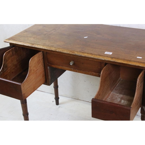 638 - 19th century Mahogany Kneehole Desk / Dressing Table, with three drawers, raised on turned ringed le... 