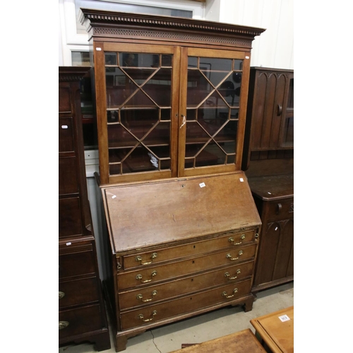 642 - George III Mahogany Bureau Bookcase, the upper section with two astragel glazed doors, over a slopin... 