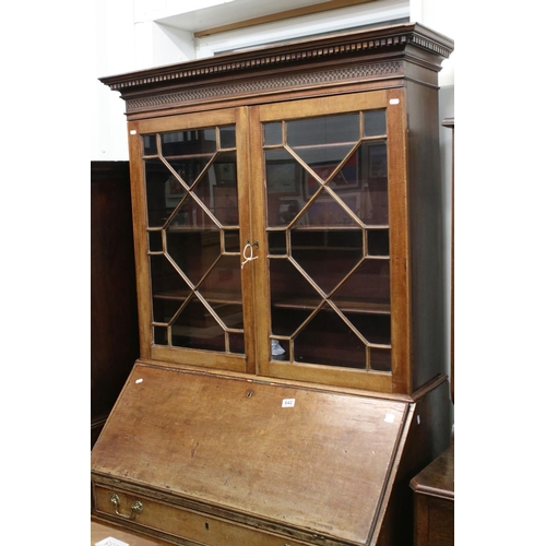 642 - George III Mahogany Bureau Bookcase, the upper section with two astragel glazed doors, over a slopin... 