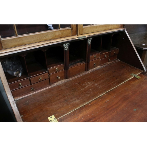 642 - George III Mahogany Bureau Bookcase, the upper section with two astragel glazed doors, over a slopin... 