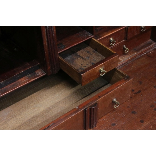 642 - George III Mahogany Bureau Bookcase, the upper section with two astragel glazed doors, over a slopin... 