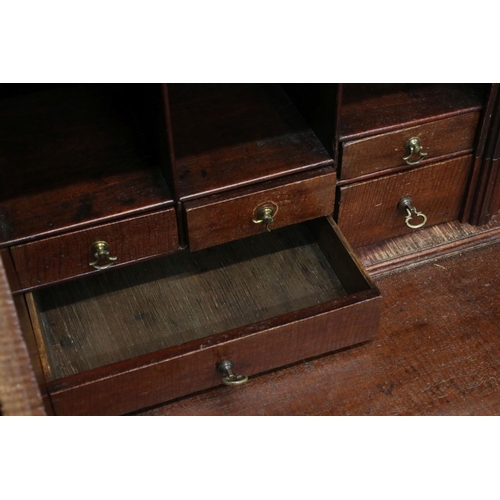 642 - George III Mahogany Bureau Bookcase, the upper section with two astragel glazed doors, over a slopin... 