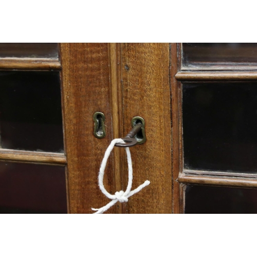 642 - George III Mahogany Bureau Bookcase, the upper section with two astragel glazed doors, over a slopin... 