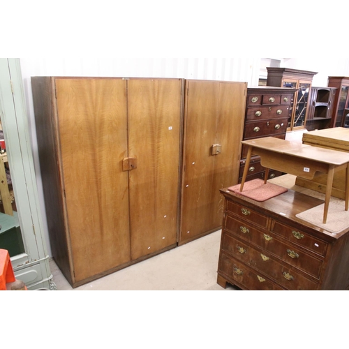 645 - Gordon Russell of Broadway, Pair of Mid century Walnut Wardrobes, both with double doors, one measur... 