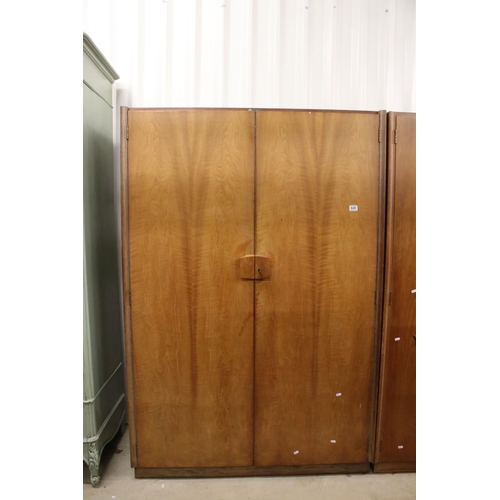 645 - Gordon Russell of Broadway, Pair of Mid century Walnut Wardrobes, both with double doors, one measur... 