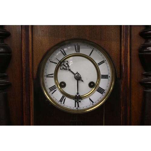 554B - Late 19th Century Vienna-style mahogany wall clock, with white enamel roman dial, pierced hands, and... 