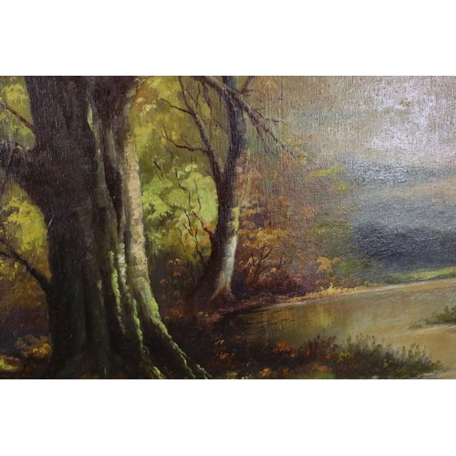 557 - Kaposy 20th century oil on canvas of autumnal trees by a lake in dusky light, signed lower right and... 