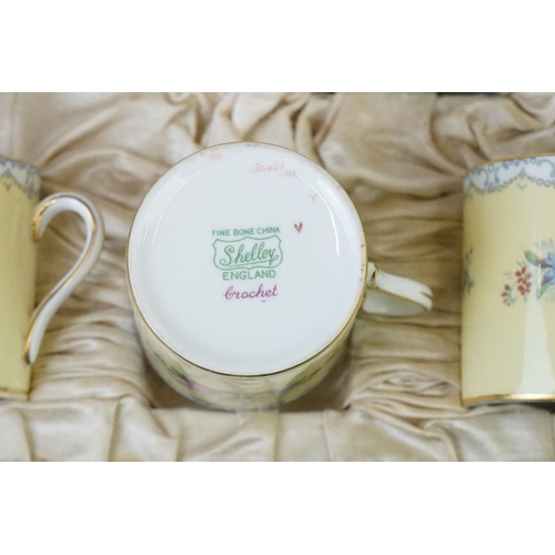 19 - Shelley Boxed Yellow ' Crochet' pattern coffee set, to include six coffee cans and saucers, with flo... 