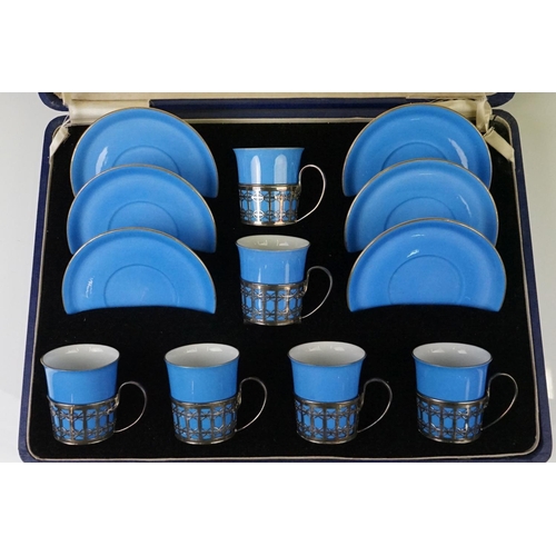 22 - Boxed Shelley Blue glazed coffee set to include six coffee cans in silver hallmarked handled mounts ... 