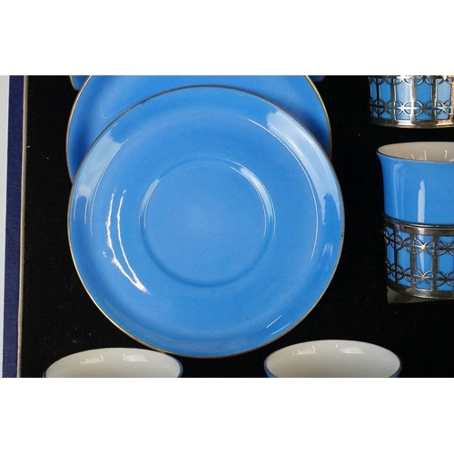 22 - Boxed Shelley Blue glazed coffee set to include six coffee cans in silver hallmarked handled mounts ... 