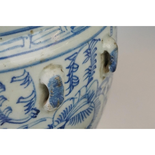 23 - Chinese porcelain lidded jar, decorated in blue and white with scrolling foliate decoration, incompl... 