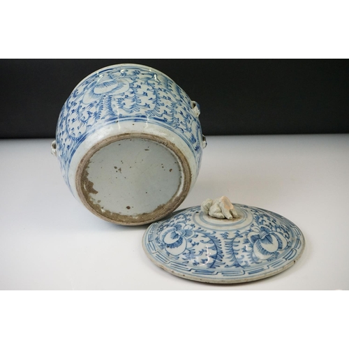 23 - Chinese porcelain lidded jar, decorated in blue and white with scrolling foliate decoration, incompl... 