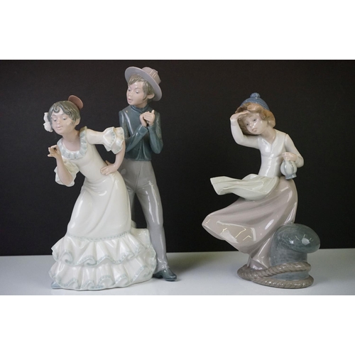 27 - Six Nao by Lladro porcelain figures to include a girl with a goat (29.5cm high), a tailor and a youn... 