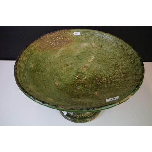 35 - Large French Artisan green glazed pottery circular footed bowl of conical form, 41cm diameter