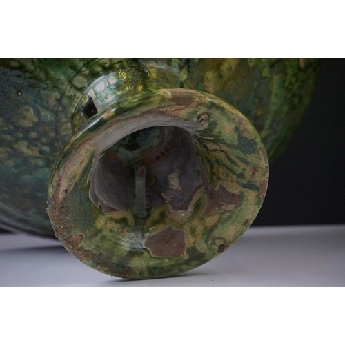 35 - Large French Artisan green glazed pottery circular footed bowl of conical form, 41cm diameter