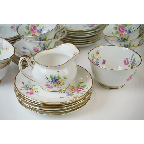 40 - Early 20th Century Hand Painted tea service with floral design on a white ground and gilt rims, to i... 