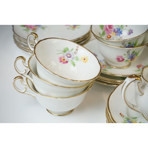 40 - Early 20th Century Hand Painted tea service with floral design on a white ground and gilt rims, to i... 