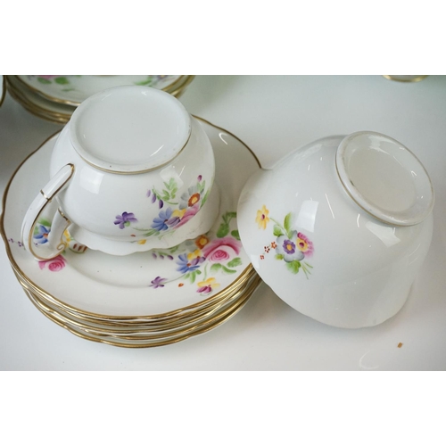 40 - Early 20th Century Hand Painted tea service with floral design on a white ground and gilt rims, to i... 