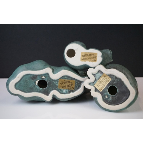 44 - Three Moorside Design mottled turquoise ceramic models of seated cats, with original paper labels, t... 