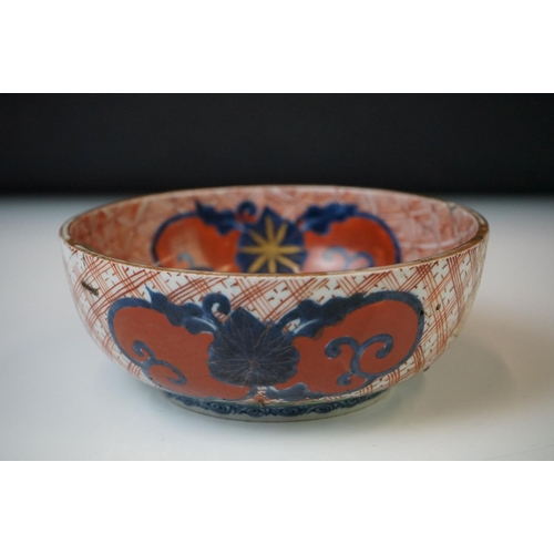 52 - Near pair of Chinese porcelain circular geometric red ground bowls bowls with red and green foliate ... 