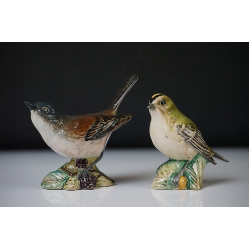 54 - Four Beswick porcelain bird figures to include Grey Wagtail (1041), Wren (993), Whitethroat (2106) a... 