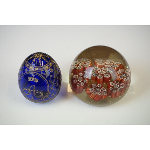 62 - A millefiori glass paperweight of mushroom shape, with a central cluster of eight canes flanked by s... 